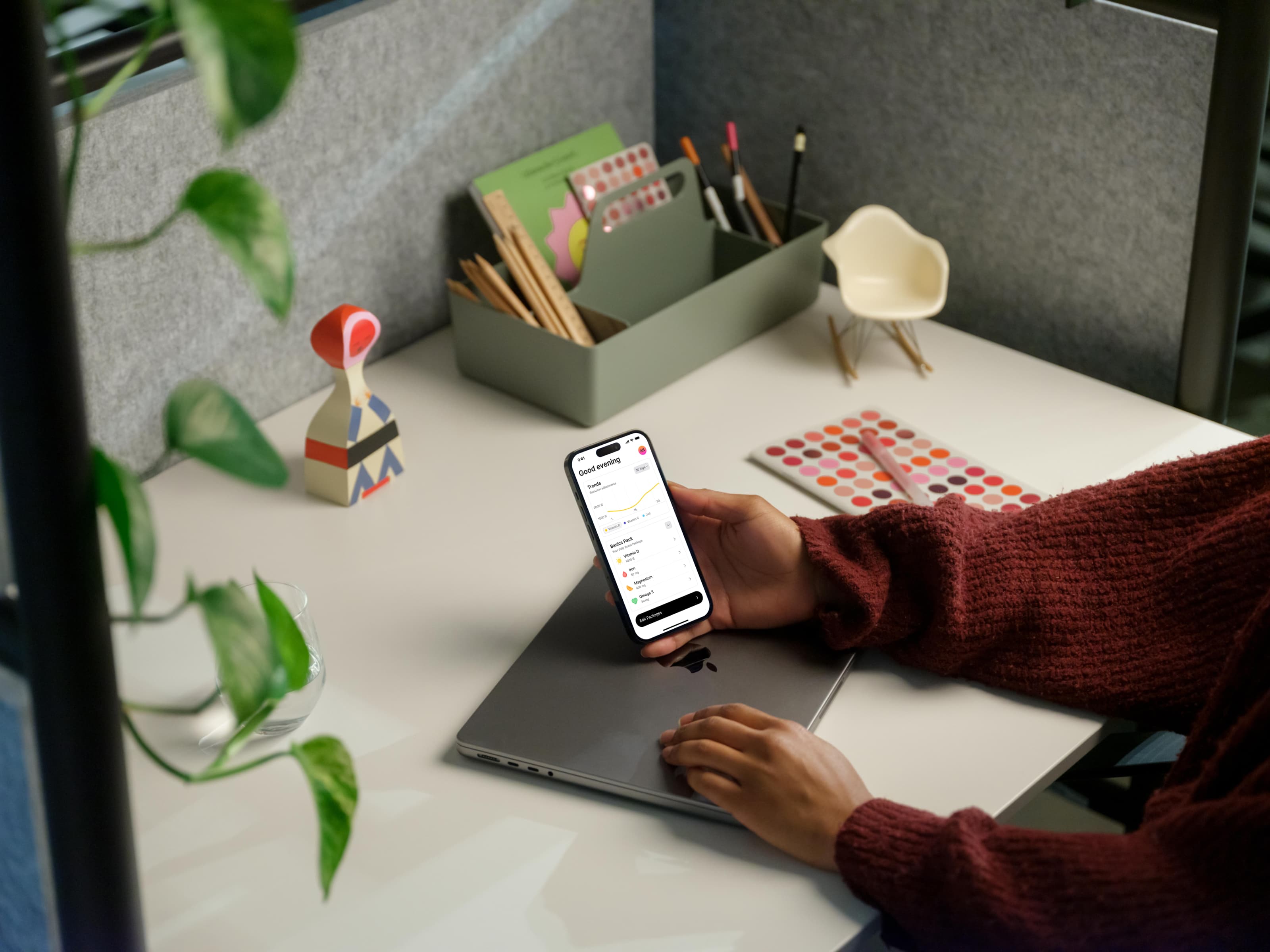 A person holding a phone with the Boost app open on the home screen